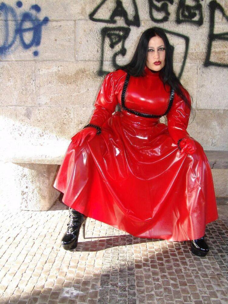 Goth woman Lady Angelina models a red latex dress during non-nude action - #16