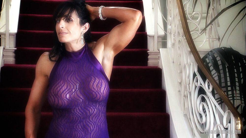 Female bodybuilder Elise Penn models non nude in a sheer sleeveless dress - #11