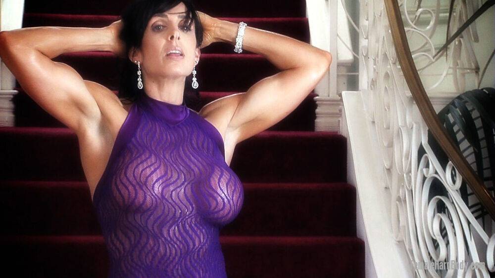 Female bodybuilder Elise Penn models non nude in a sheer sleeveless dress - #5