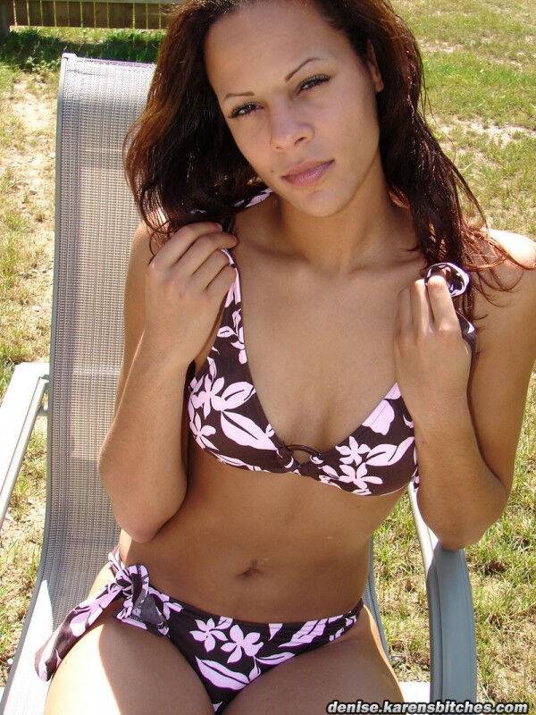 Young amateur Karen models a floral print bikini on a backyard chair - #9