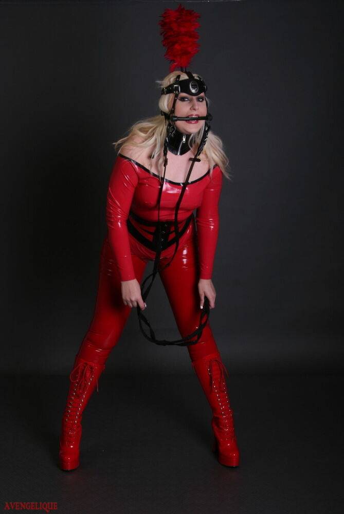 Blonde female models a red latex ponygirl outfit during a non-nude session - #13