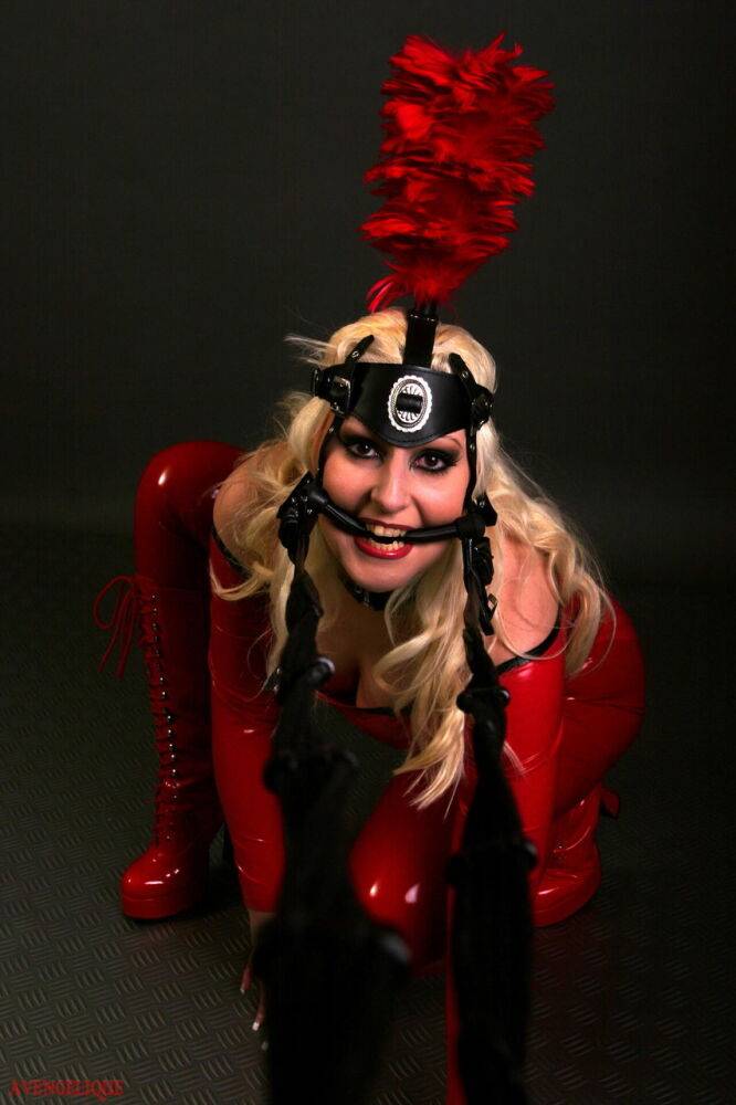 Blonde female models a red latex ponygirl outfit during a non-nude session - #11