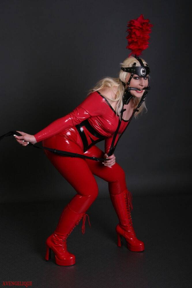 Blonde female models a red latex ponygirl outfit during a non-nude session - #3