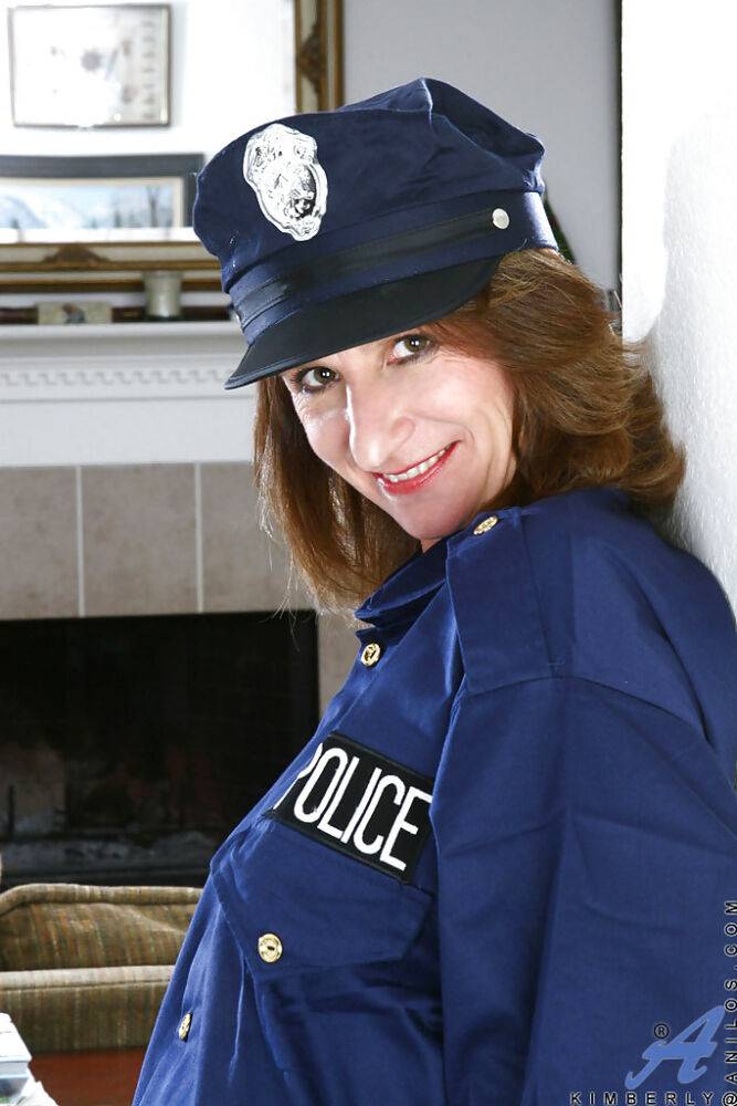 Luscious mature in lady cop uniform brings out nice boobies and tight ass - #10