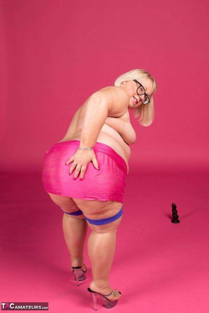 Blonde fatty Lexie Cummings models topless in glasses and stockings - #7