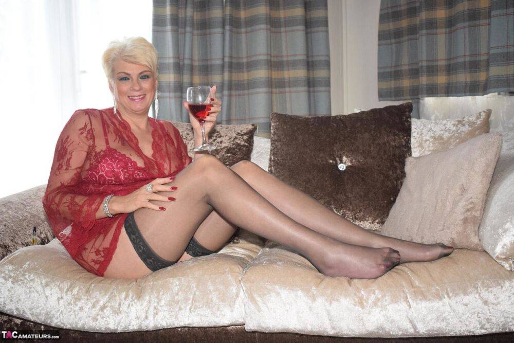 Older blonde Dimonty models sexy lingerie and stockings over a drink - #15