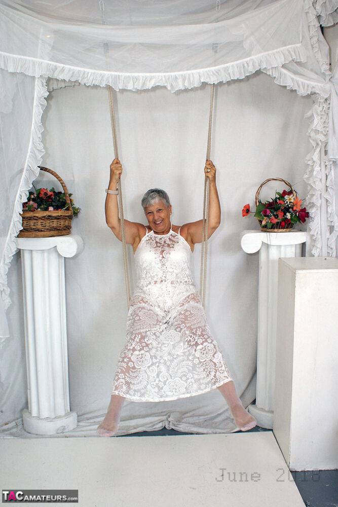 Short haired oma Savana models all white lingerie and hosiery on a swing - #14