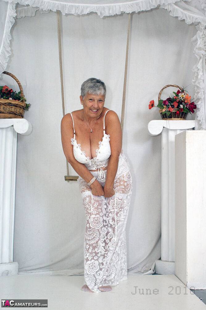 Short haired oma Savana models all white lingerie and hosiery on a swing - #12