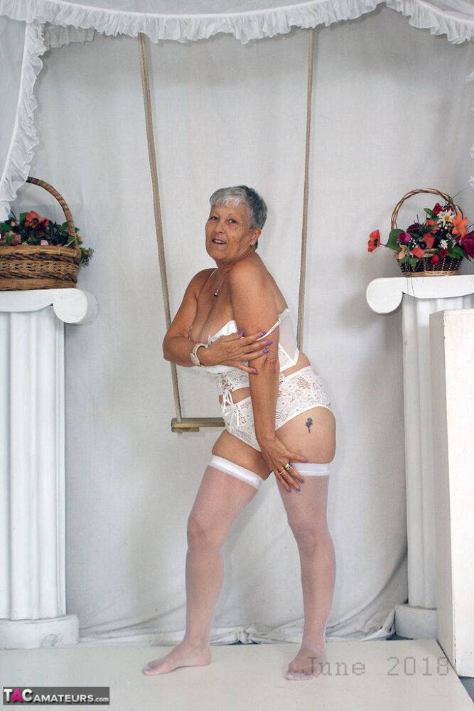 Short haired oma Savana models all white lingerie and hosiery on a swing - #16