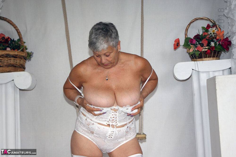 Short haired oma Savana models all white lingerie and hosiery on a swing - #10