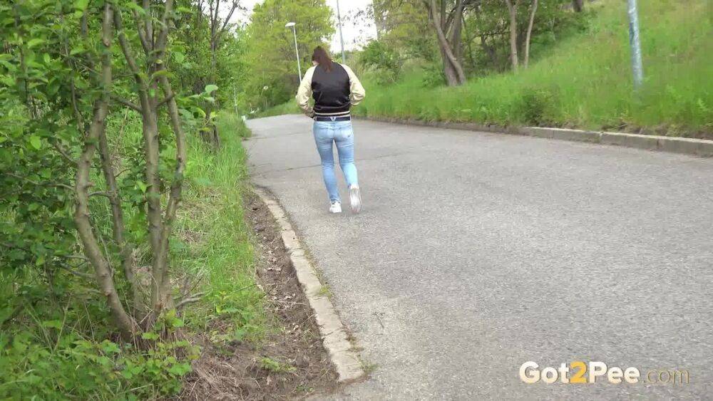 Clothed girl pulls down ripped jeans for a pee while bicyclists pass by her - #14