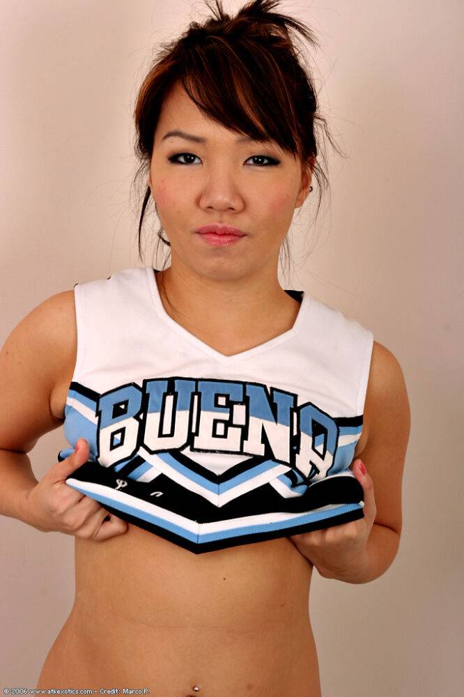 Amateur Asian solo girl sheds cheerleader uniform to bare tiny teen tits - #9