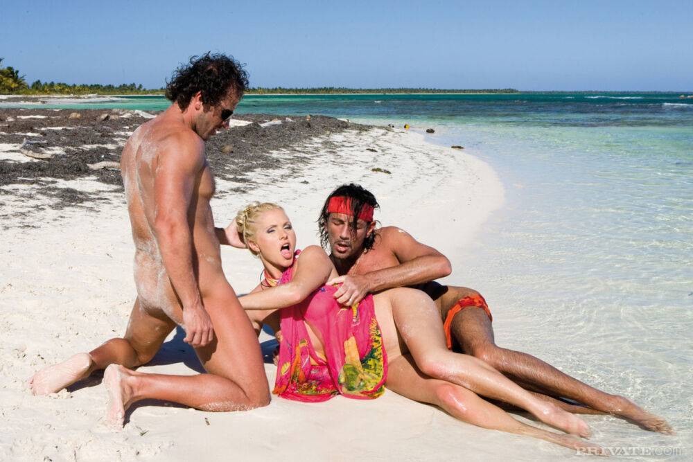 Beautiful blonde Kathy Anderson has sex with two men on a beach - #10