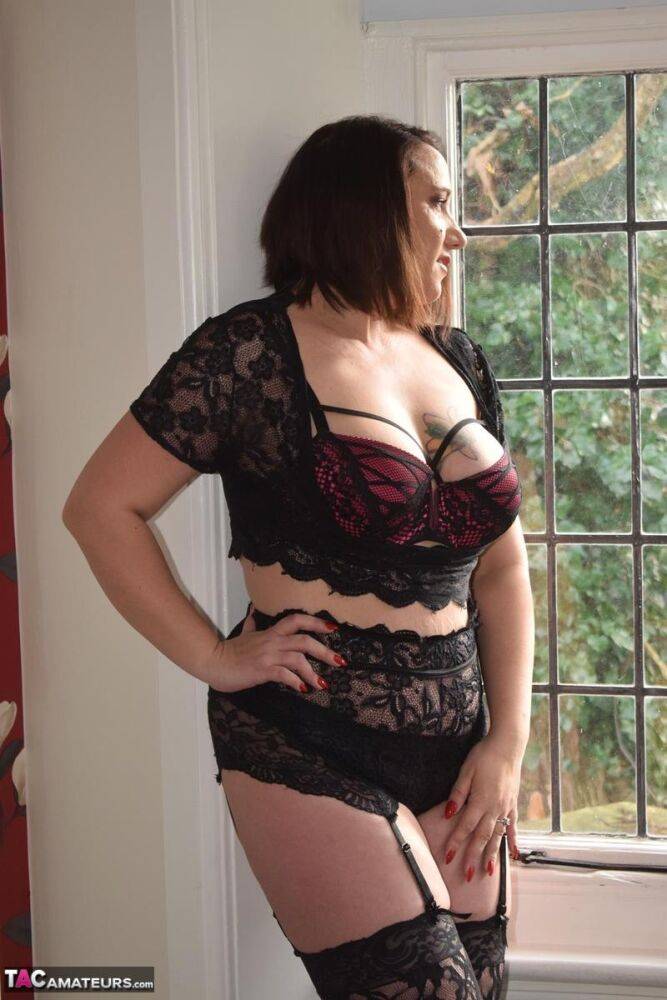 Mature brunette Sara Banks casually looses her big tits from lingerie - #6