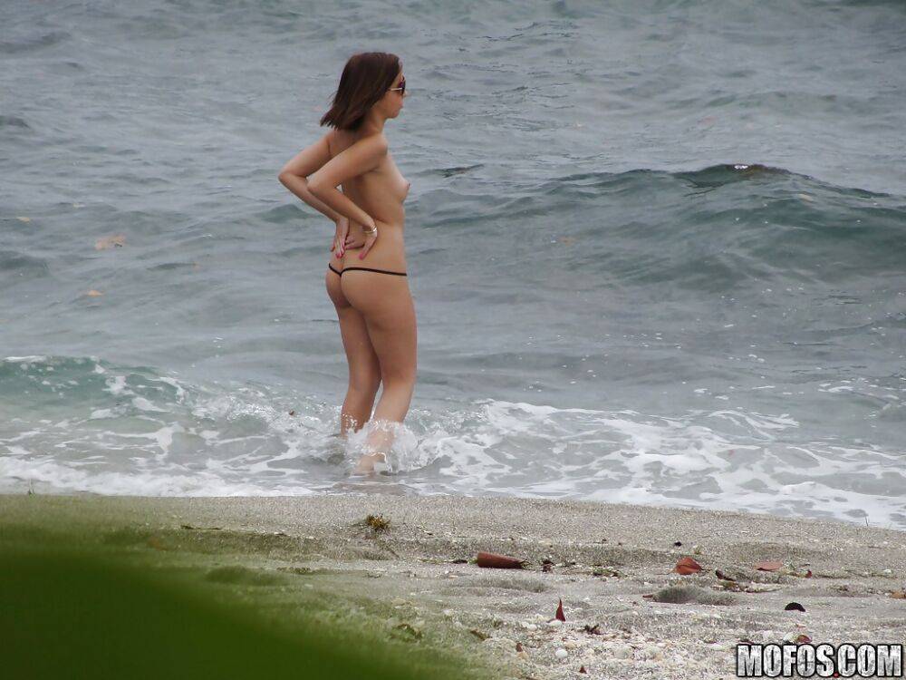 Brunette teen Krystal Banks gets sneak-peaked by a voyeur on the beach - #9