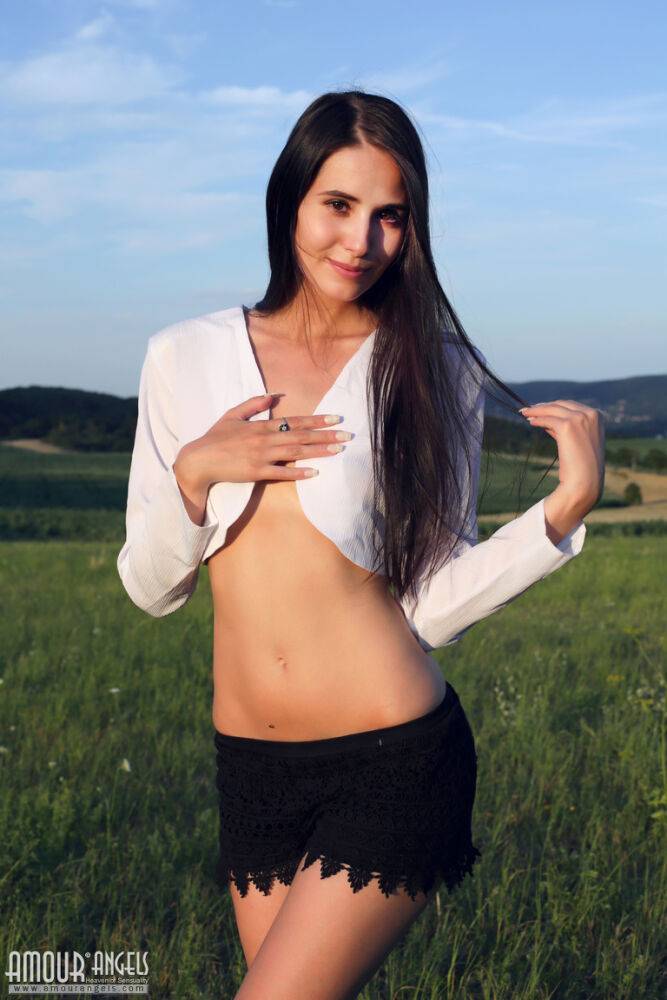 Beautiful teen Vanessa gets completely naked while in a farmer's field - #14