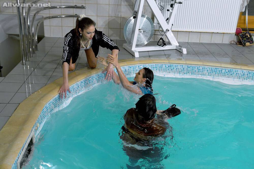 Fully clothed fetish gals spending some good time in the pool - #10