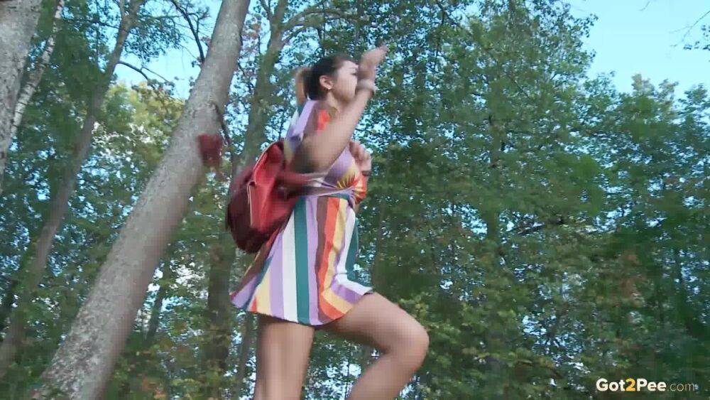 Leggy girl Diana Sweet takes a pee behind a tree while taking a shortcut - #8