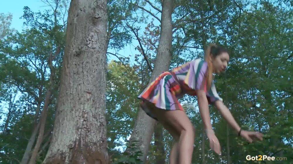 Leggy girl Diana Sweet takes a pee behind a tree while taking a shortcut - #1