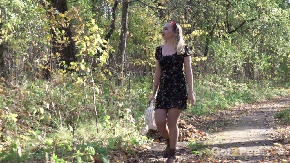 Blonde chick Diana pulls down her pantyhose to take a piss beside a tree - #12