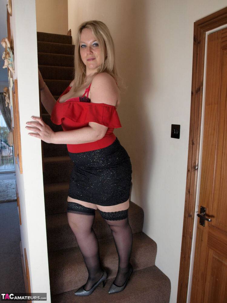 Blonde BBW Sindy Bust unveils her huge tits and big butt on the stairs - #15