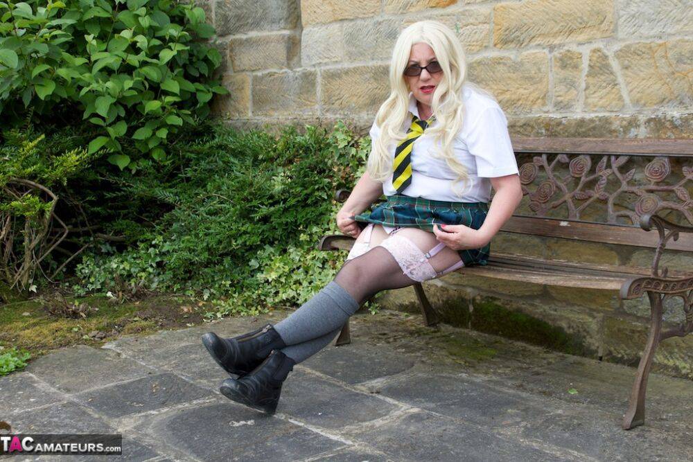 UK blonde Barby Slut masturbates on a garden bench while in schoolgirl attire - #9