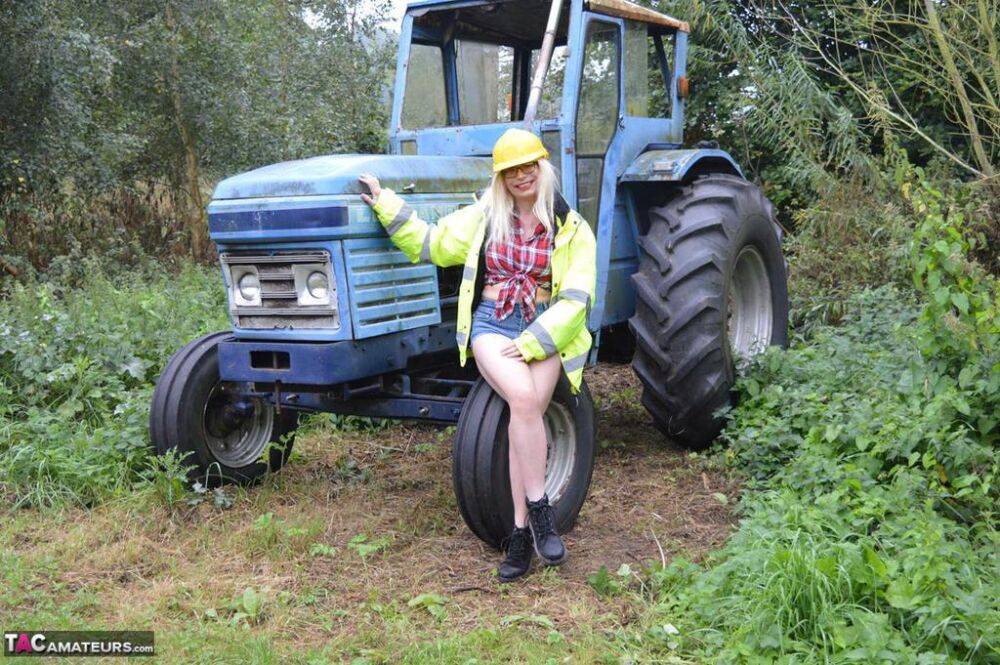 Mature amateur Barby Slut exposes herself on heavy equipment at a job site - #15