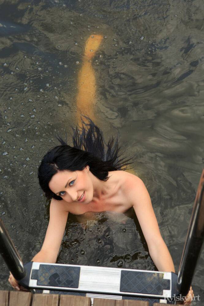 Dark haired teen Janelle gets totally naked after emerging from a river - #2