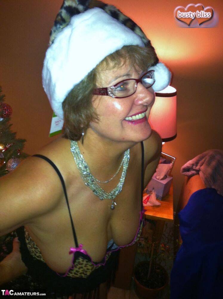 Old amateur Busty Bliss pulls out her boobs while getting naked at Christmas - #9