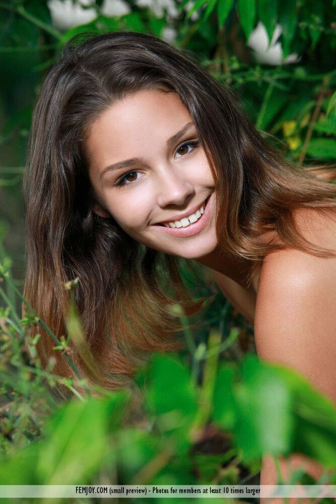 Petite teen Arina F removes black bra and panty set in front of undergrowth - #10