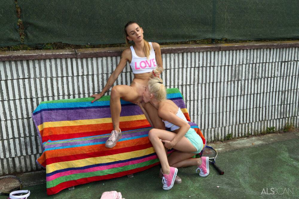 Young lesbians Adelle Unicorn & Kiara Cole share a dildo after a tennis match - #3