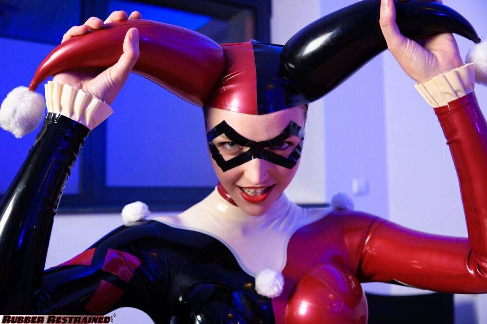 Solo model Harley Quinn poses for a non nude shoot in a costume made of latex - #11