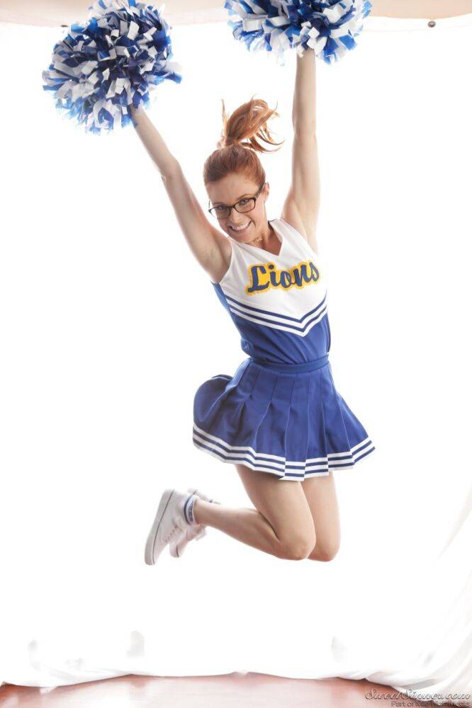 Cute redhead cheerleader Penny Pax in glasses baring big tits & firm ass - #12