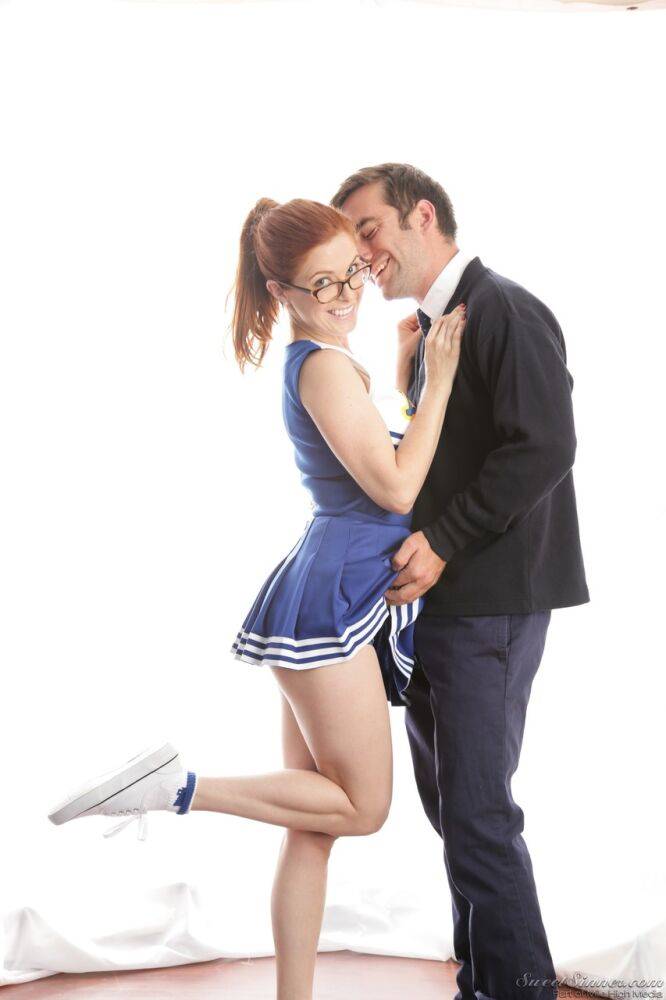 Cute redhead cheerleader Penny Pax in glasses baring big tits & firm ass - #6