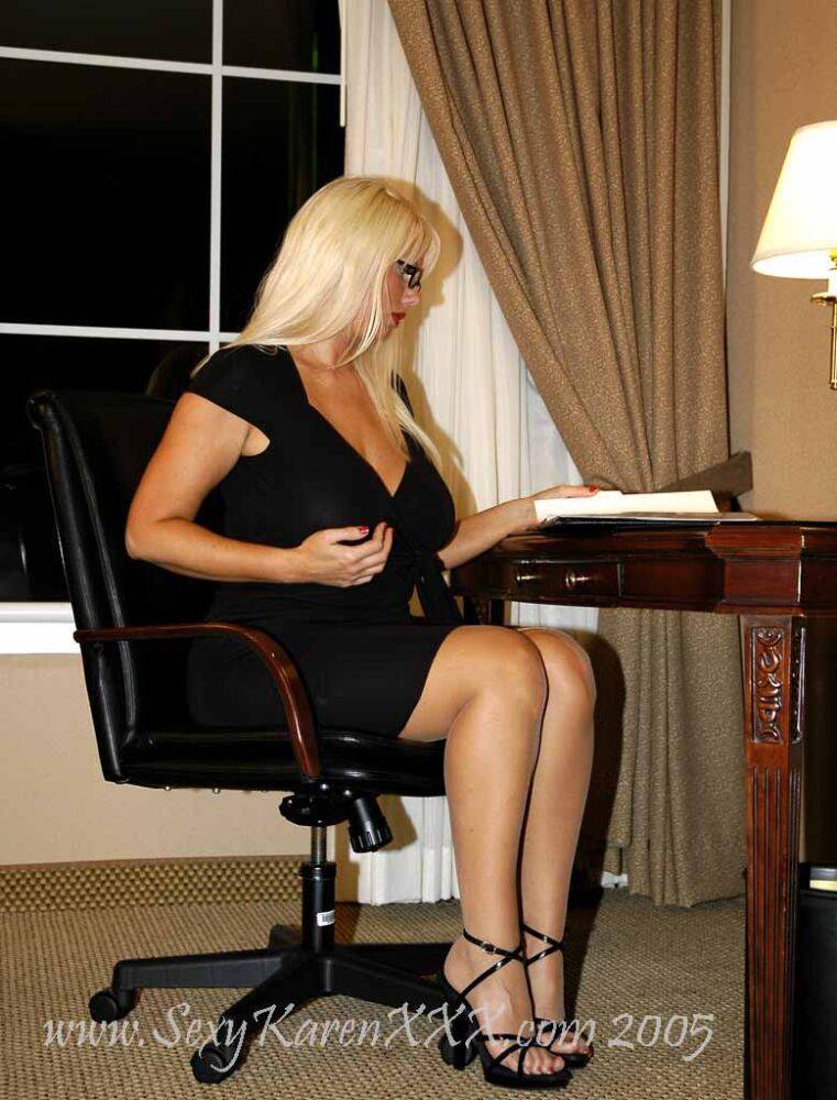 Blonde businesswoman Karen Fisher releases her firm tits from a black dress | Photo: 3049611