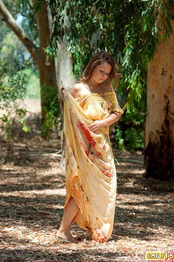 Emily 18 wears a long, flowy hippie dress outdoors and poses under the shade - #7