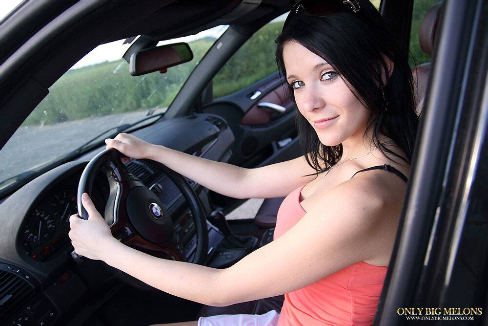 Pretty brunette uncovers her big boobs while driving a vehicle - #4