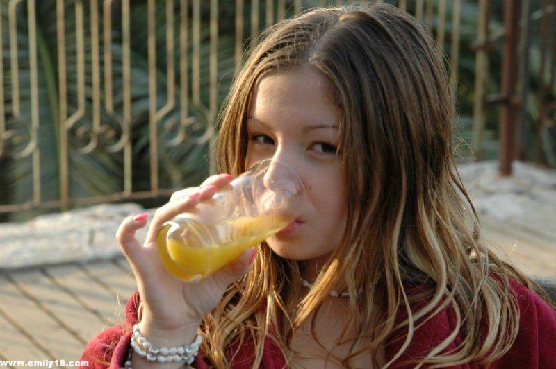 Charming young girl teases in lingerie after a glass of OJ for breakfast - #5