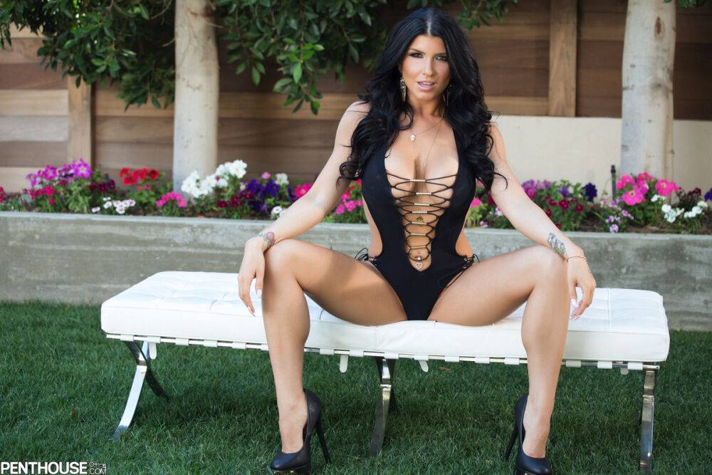 Tattooed brunette Romi Rain removes a swimsuit to pose nude in a yard - #3