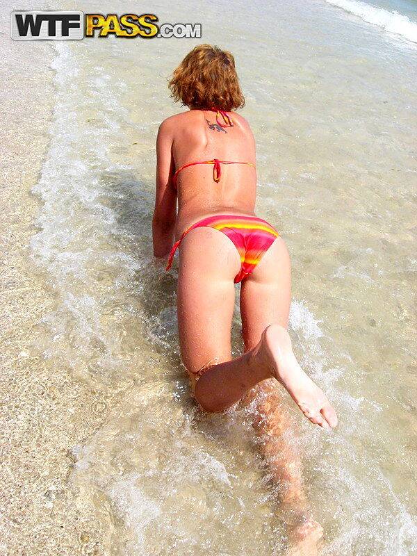 Amateur girl with red hair changes into a bikini before getting in the ocean - #14