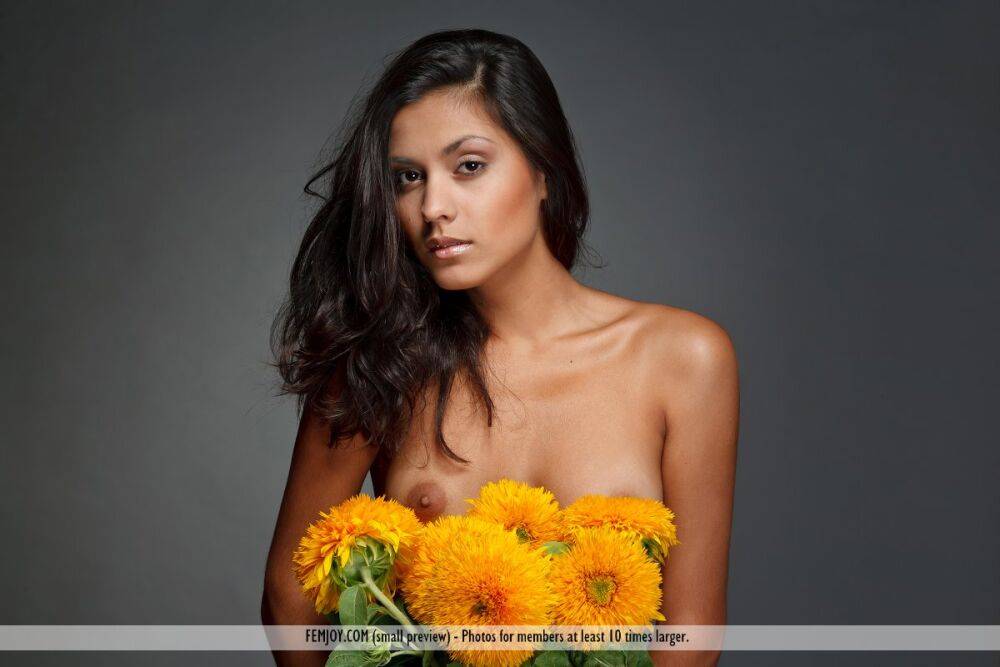 Brunette solo girl puts down a bunch of flowers while modeling in the nude - #8