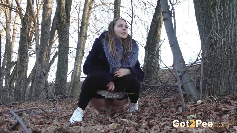 Short taken girl pulls down tights to take a pee while walking thru the woods - #4