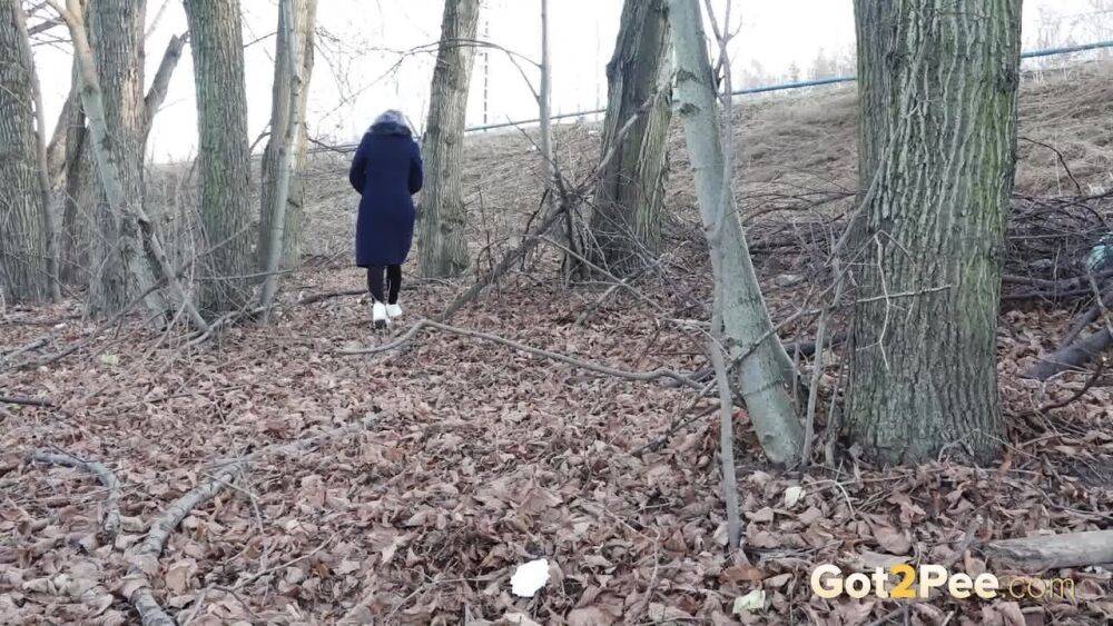 Short taken girl pulls down tights to take a pee while walking thru the woods - #13