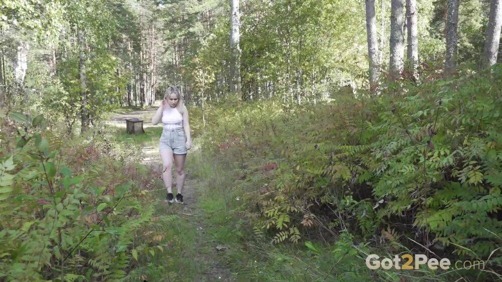 Blonde girl Nastya takes a piss on the steps of an abandoned cabin - #11