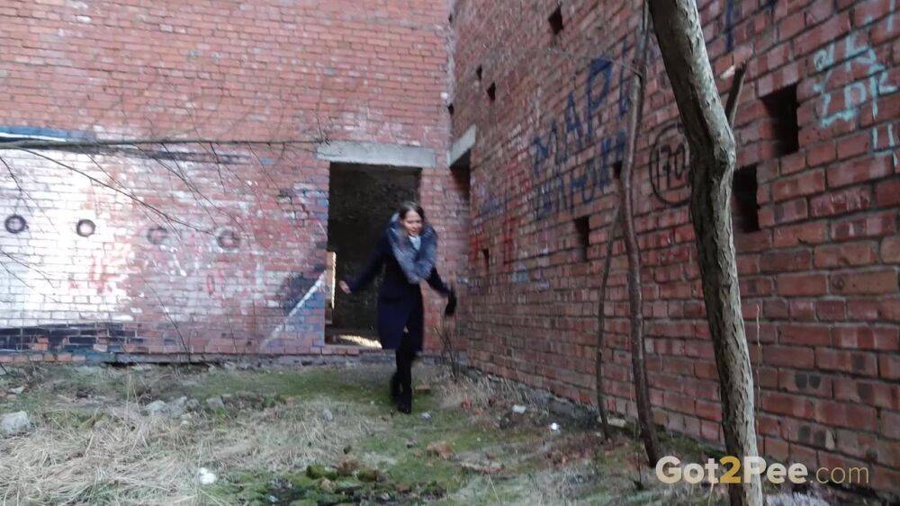 Distressed girl Nastya pulls down her tights to pee by an abandoned building - #11