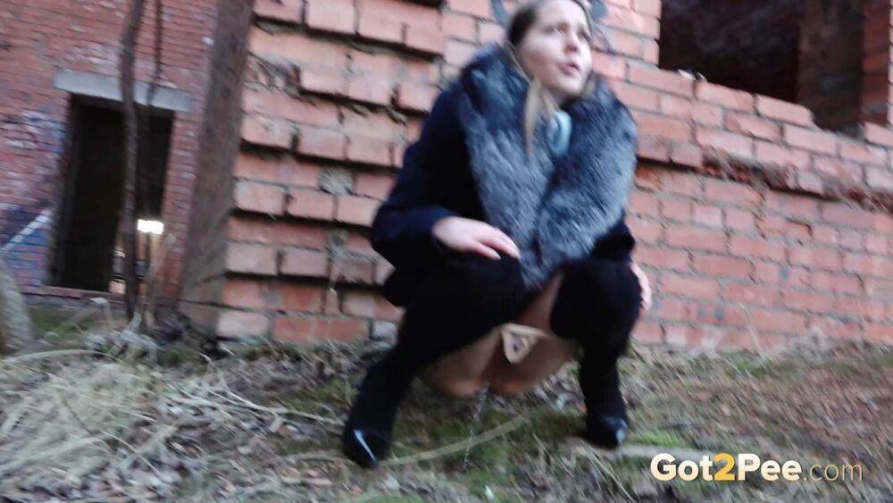 Distressed girl Nastya pulls down her tights to pee by an abandoned building - #8