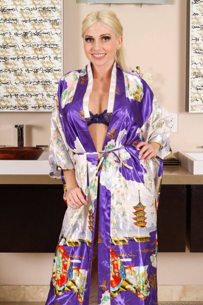 Busty girl Christie Stevens stands naked after removing bath robe and lingerie | Photo: 3252024