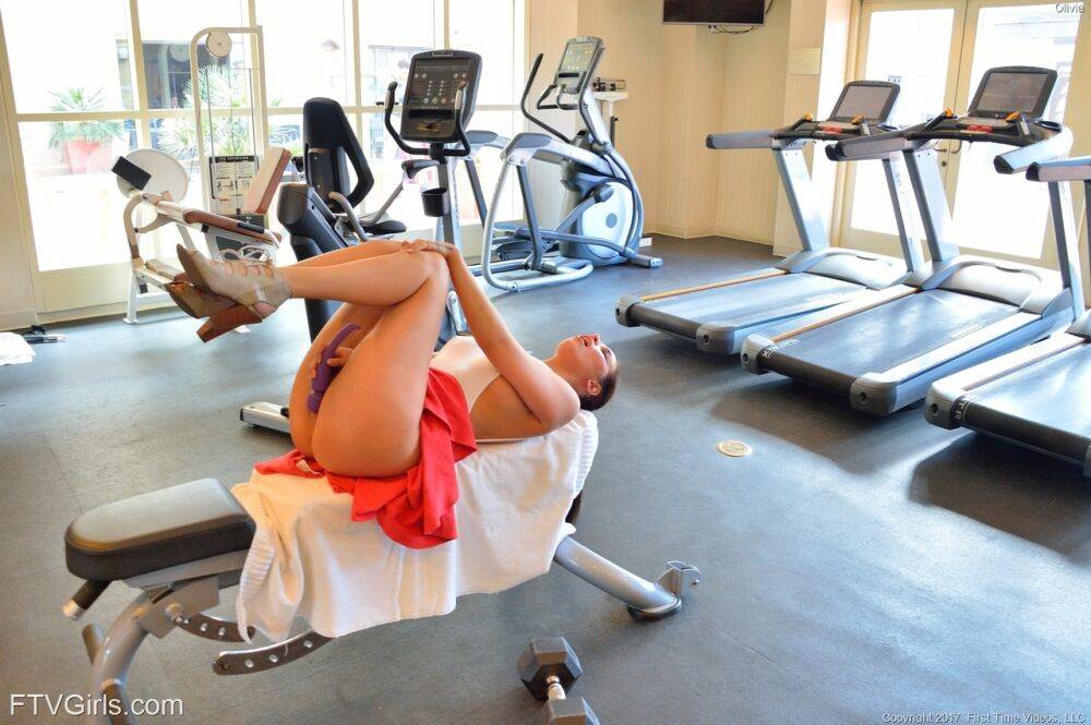 Naughty girl flashes her tits and pussy in lounge and on exercise equipment - #6