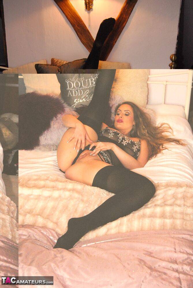 UK amateur Sophia Delane displays her bald twat on a bed in black stockings - #11