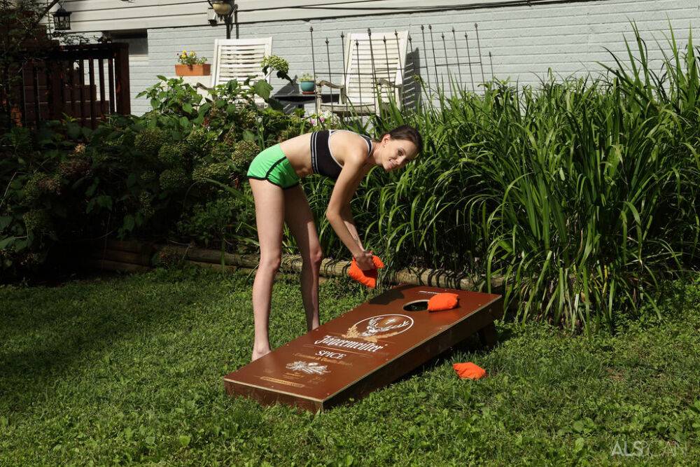 Slender brunette teen Aria Haze dildos her tight pussy atop bean bag toss - #1